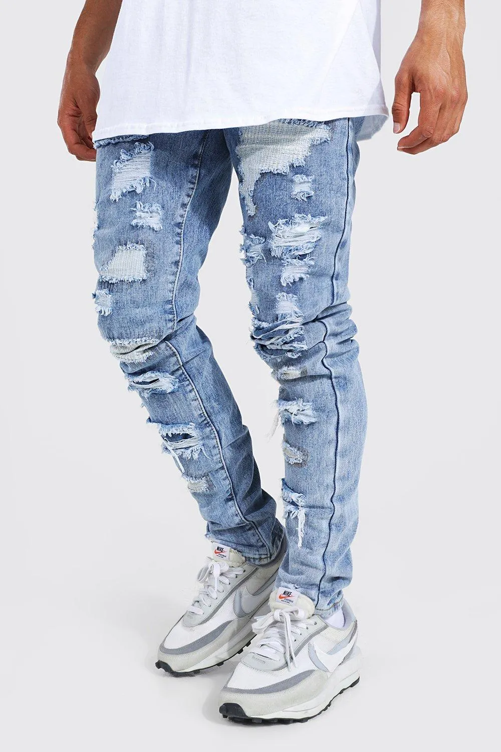 Tapered Stacked All Over Rip Jeans